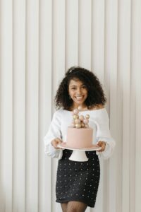 A smiling woman enjoying her birthday in a cute outfit