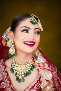 A smiling bride in a beautiful wedding outfit.